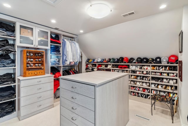 walk in closet featuring lofted ceiling