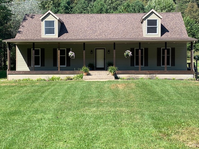 view of front of property with covered porch and a front lawn