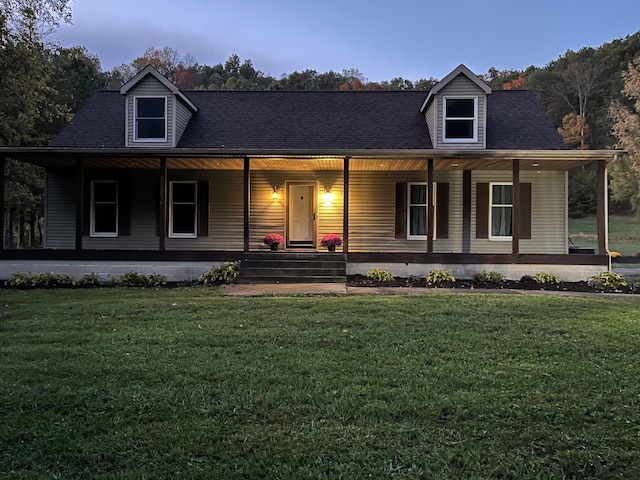 view of front facade with a yard and a porch