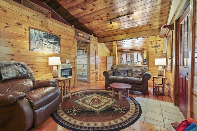 living room with hardwood / wood-style floors, vaulted ceiling, wooden ceiling, and wood walls