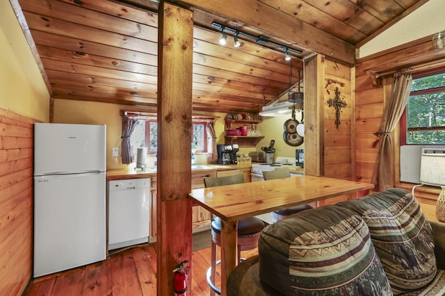 kitchen featuring white appliances, wooden ceiling, vaulted ceiling, a wealth of natural light, and wood-type flooring