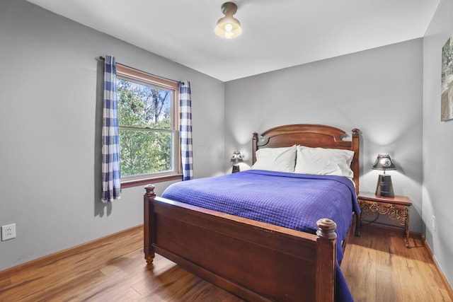 bedroom with hardwood / wood-style floors