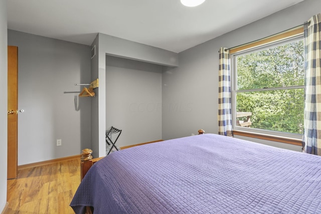 bedroom with light wood-type flooring