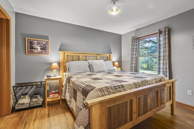 bedroom featuring hardwood / wood-style floors