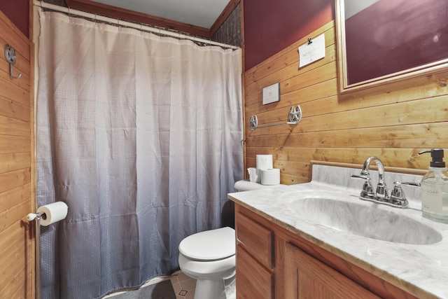 bathroom featuring toilet, tile patterned floors, and wood walls