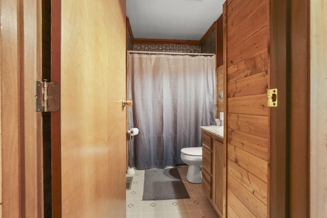 bathroom featuring vanity, crown molding, tile patterned flooring, a shower with shower curtain, and toilet