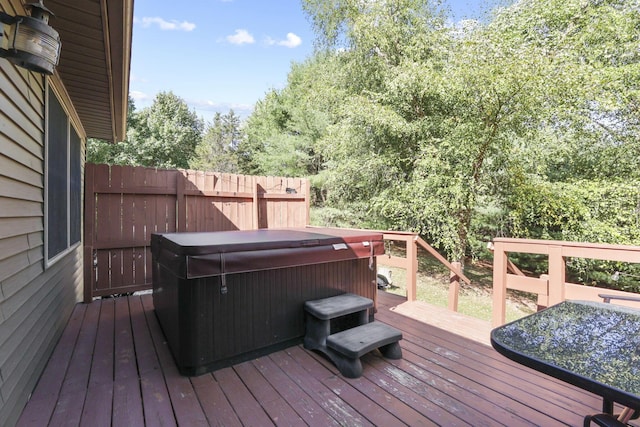 wooden terrace with a hot tub