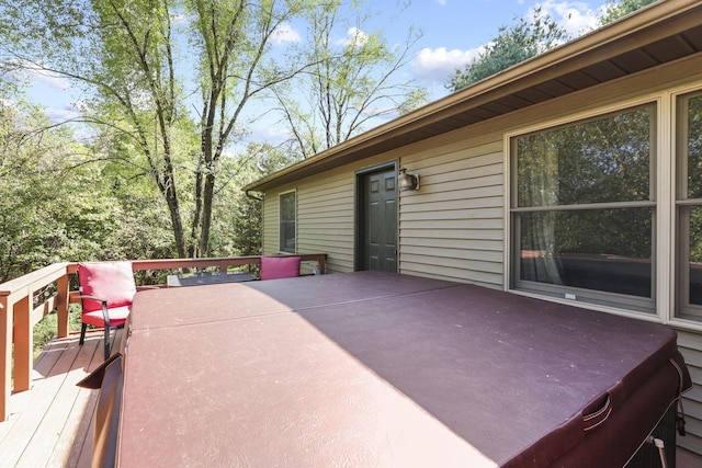 deck featuring a hot tub