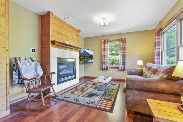 living room with hardwood / wood-style floors and a fireplace