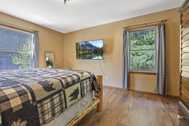 bedroom with wood-type flooring