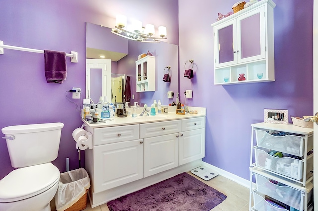 bathroom with tile patterned floors, vanity, and toilet