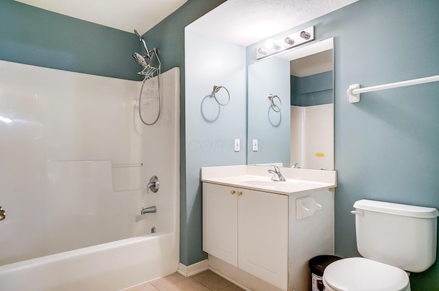 full bathroom with tile patterned floors, vanity, toilet, and washtub / shower combination