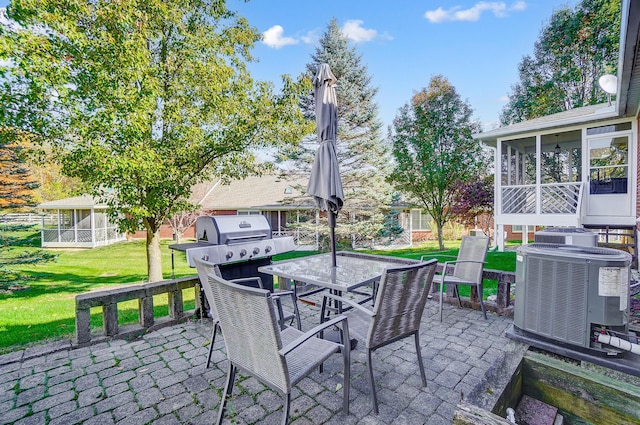 view of patio with a grill, central AC, and a sunroom