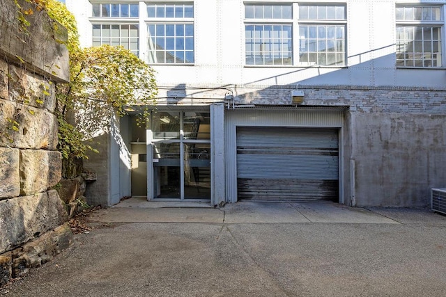 view of exterior entry with a garage