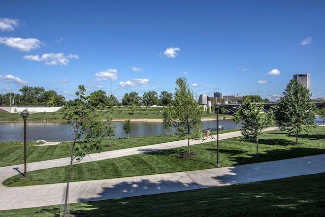 view of property's community featuring a water view and a yard