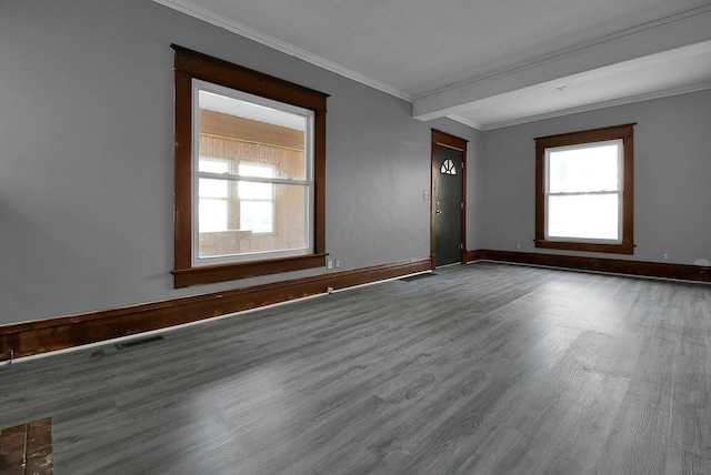 unfurnished room with crown molding and wood-type flooring