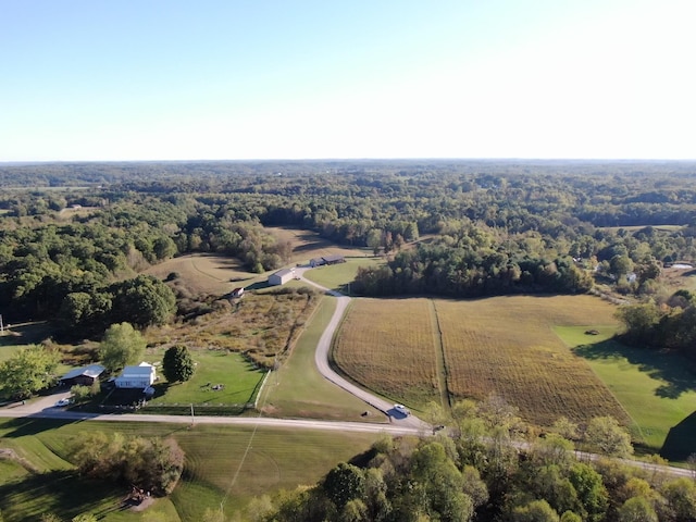 birds eye view of property with a rural view