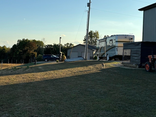 view of yard with an outbuilding and a garage