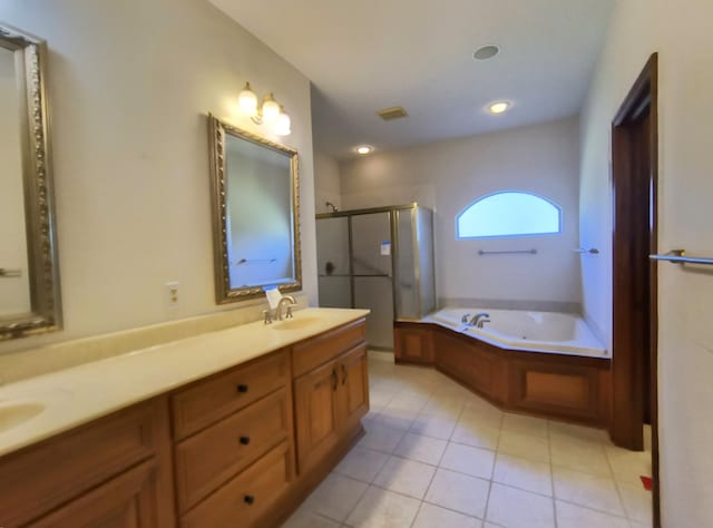 bathroom featuring tile patterned floors, vanity, and separate shower and tub