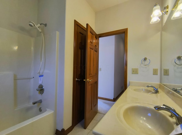 bathroom with tile patterned floors, vanity, and bathing tub / shower combination