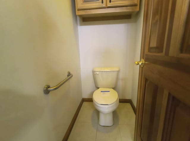 bathroom featuring toilet and tile patterned floors