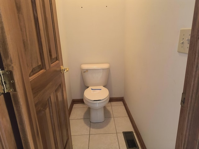 bathroom featuring tile patterned flooring and toilet