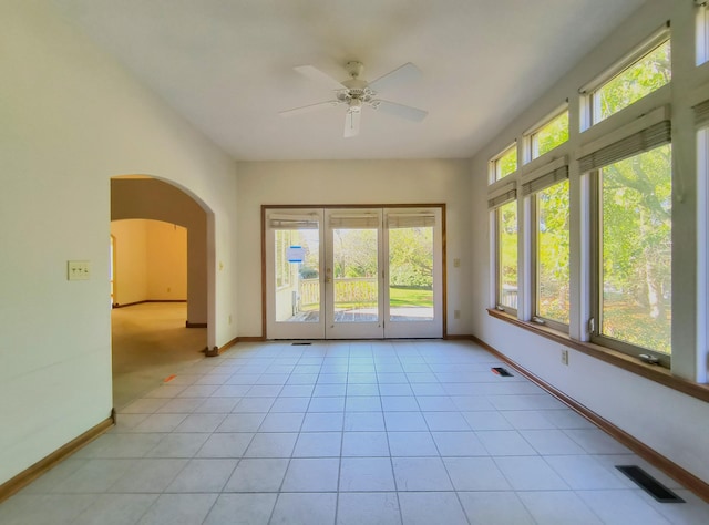 interior space featuring ceiling fan