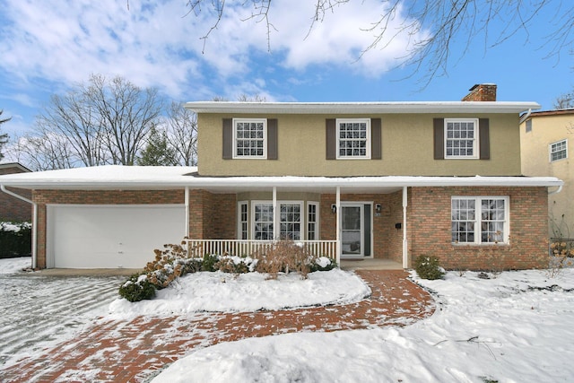 view of front of house with covered porch and a garage