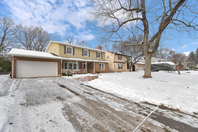 front of property with a garage