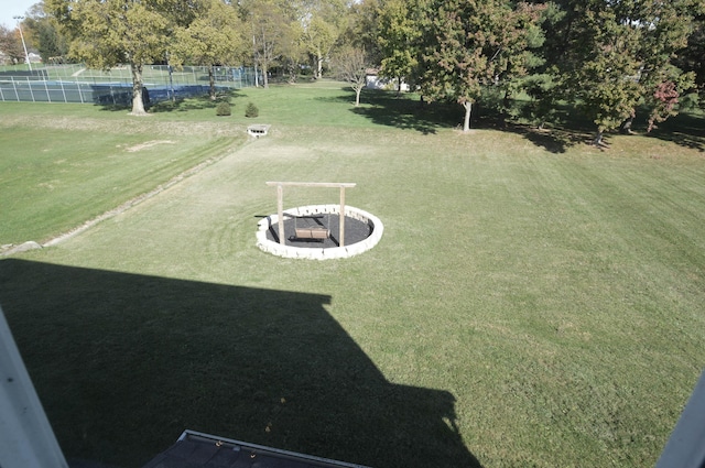 view of yard with a fire pit