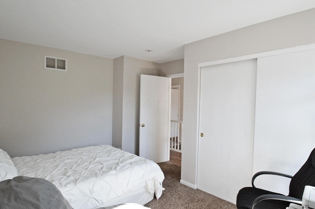 carpeted bedroom featuring a closet