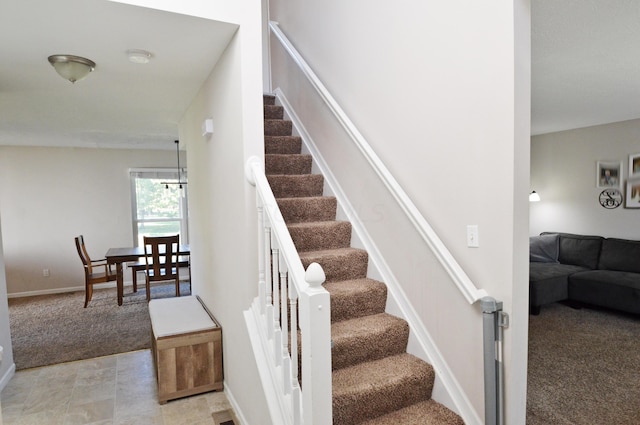 stairs featuring carpet