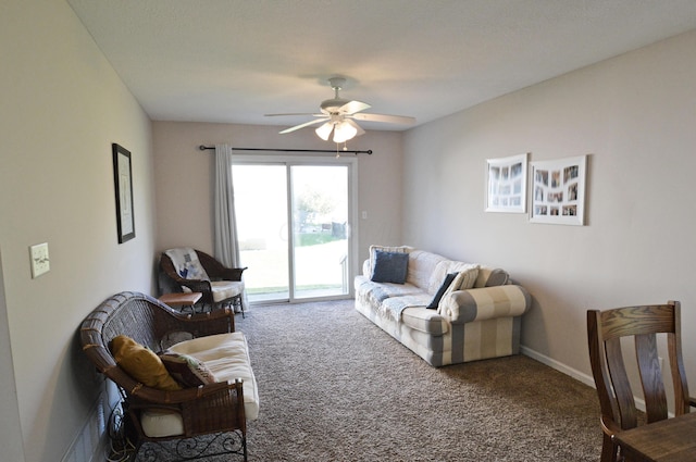 carpeted living room with ceiling fan