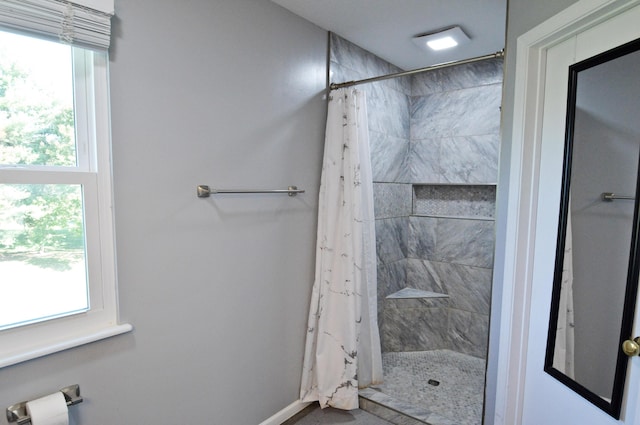 bathroom featuring curtained shower