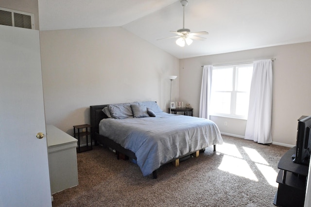 carpeted bedroom with ceiling fan and vaulted ceiling