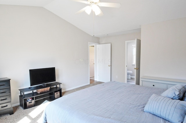 carpeted bedroom with ensuite bath, ceiling fan, and lofted ceiling