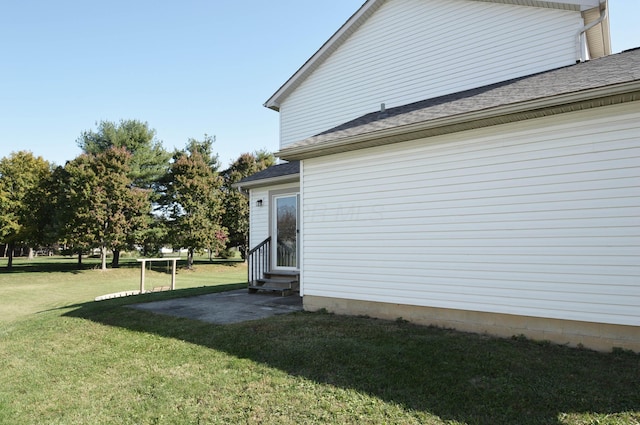 view of property exterior with a yard