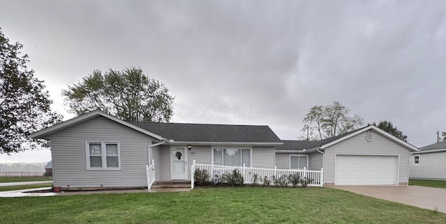 single story home with a front yard and a garage