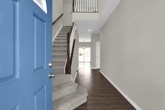 foyer with dark wood-type flooring