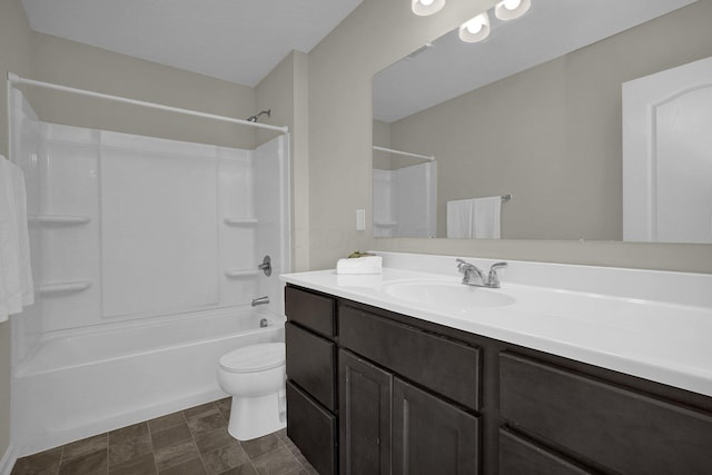 full bathroom featuring shower / bathing tub combination, vanity, and toilet