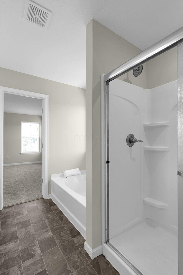 bathroom featuring plus walk in shower