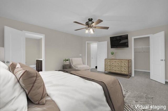 bedroom featuring carpet, connected bathroom, a closet, and ceiling fan