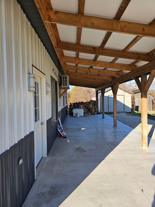 view of patio with a carport and an outdoor structure