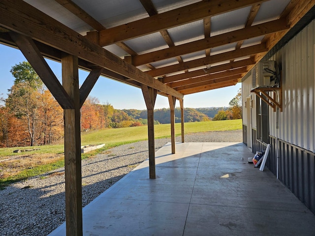 view of patio featuring a rural view and a mountain view