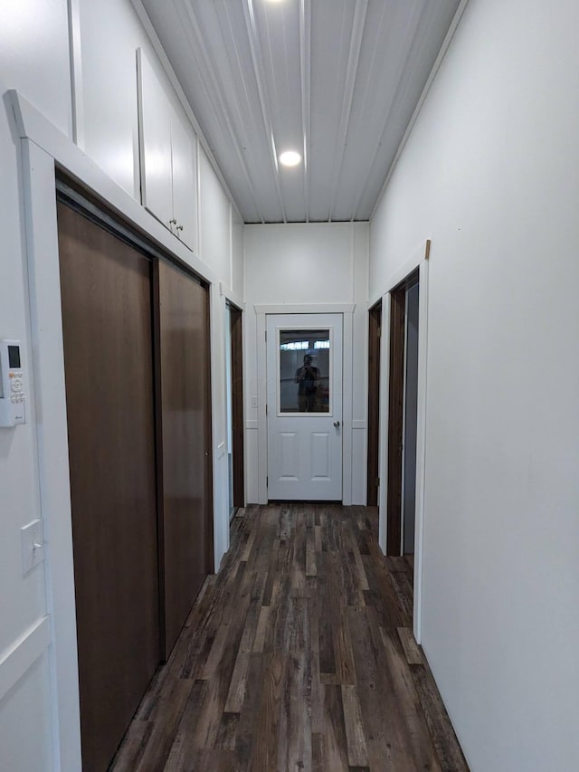 corridor featuring dark wood-style floors