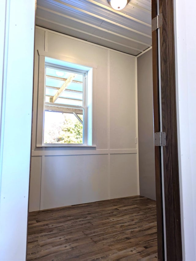 spare room featuring dark wood-style flooring