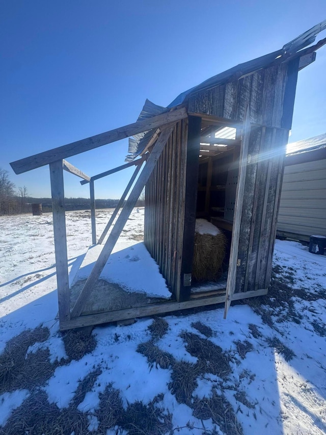 view of snow covered property entrance