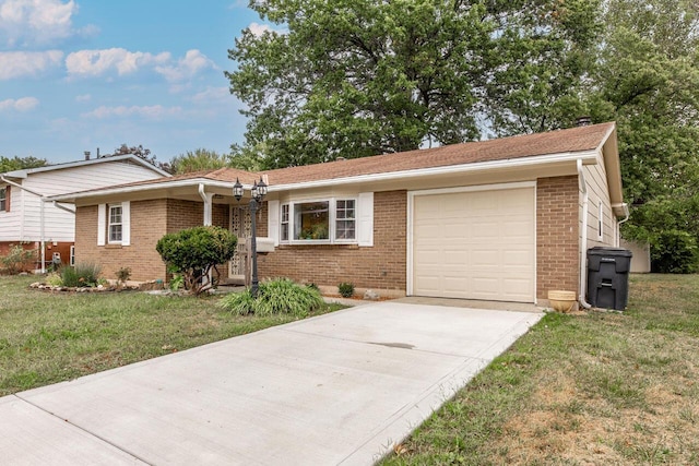 view of front of home featuring a garage and a front lawn