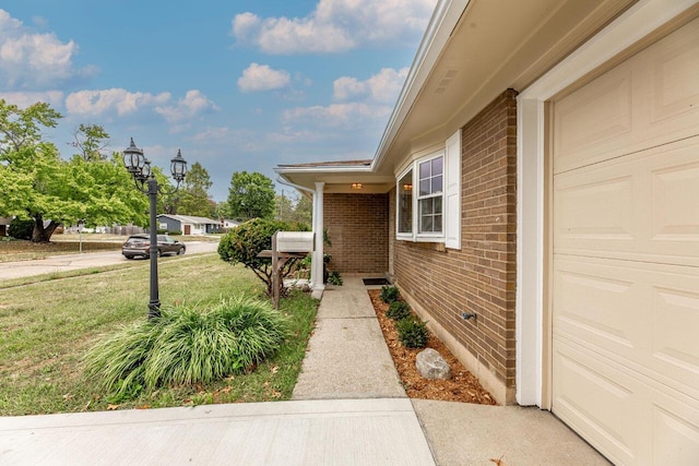 doorway to property with a yard