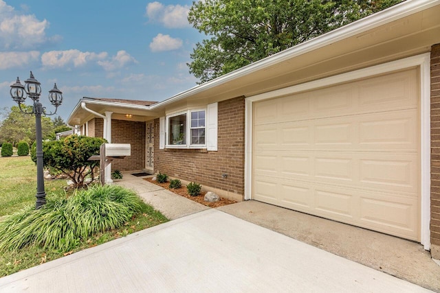 ranch-style house featuring a garage